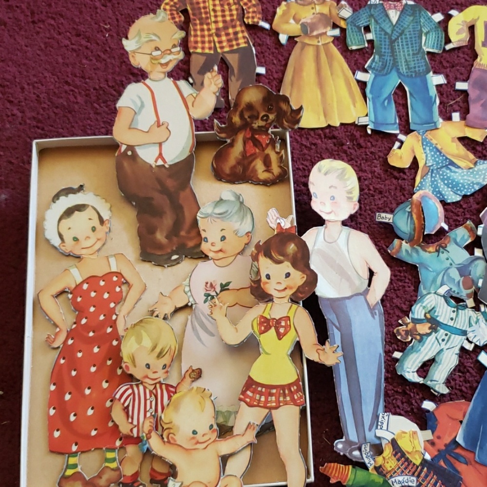 Assortment of vintage paper dolls